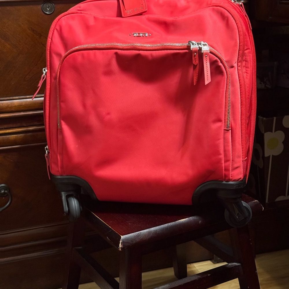 Red Wheeled Tumi Bag